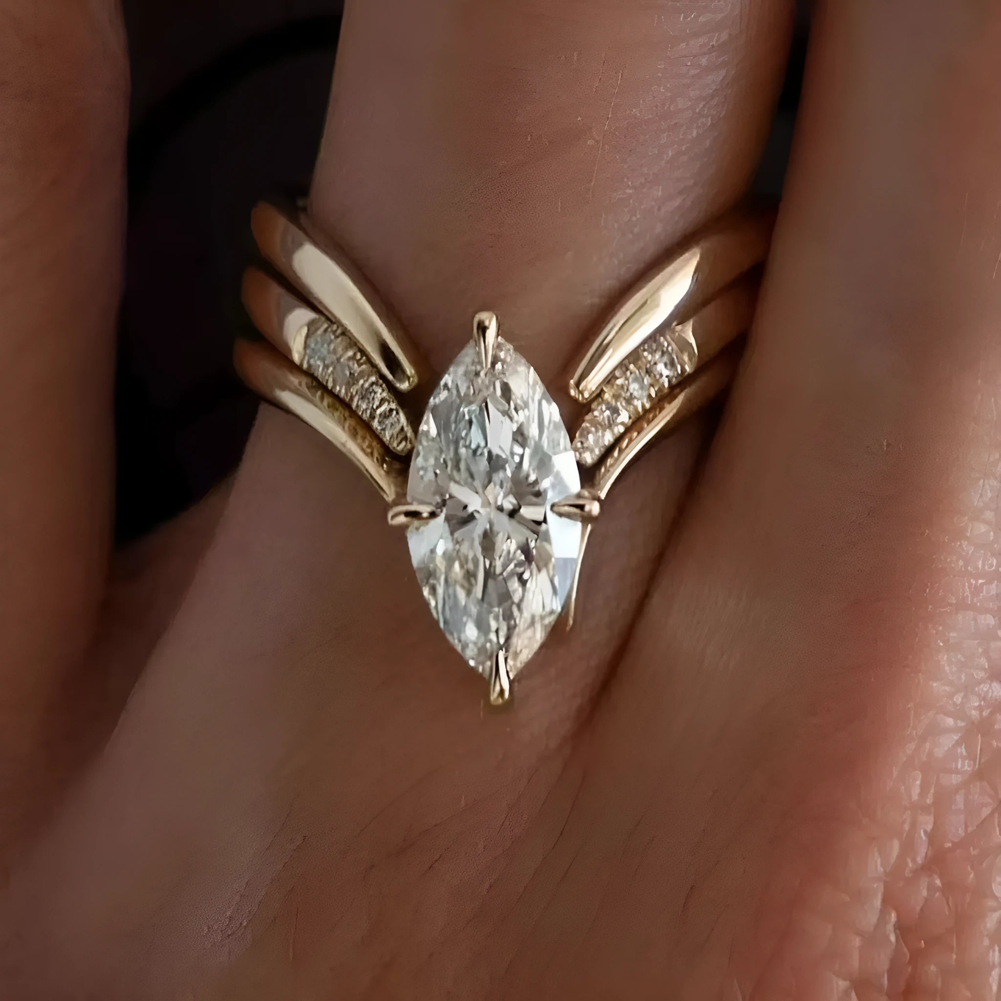 Gold zinc alloy three-piece geometric ring set with horse eye inlay on white background