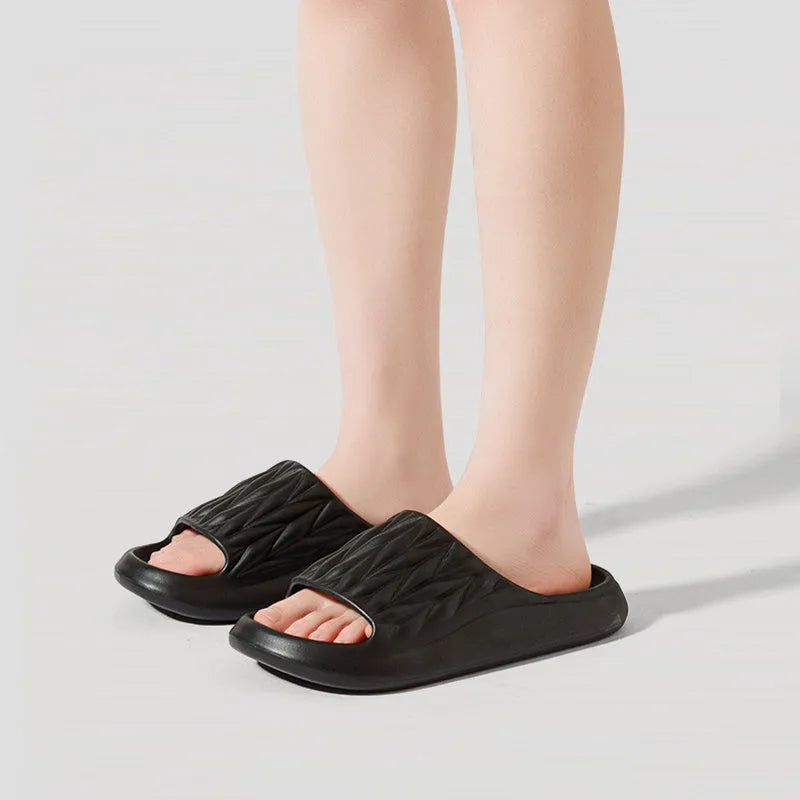 Leaf texture pattern EVA slippers for men and women in various colours on a white background.