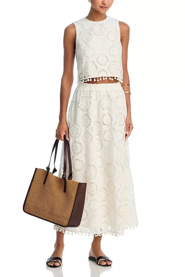 Women's white embroidered sleeveless suit with matching long skirt, retro two-piece set on a hanger