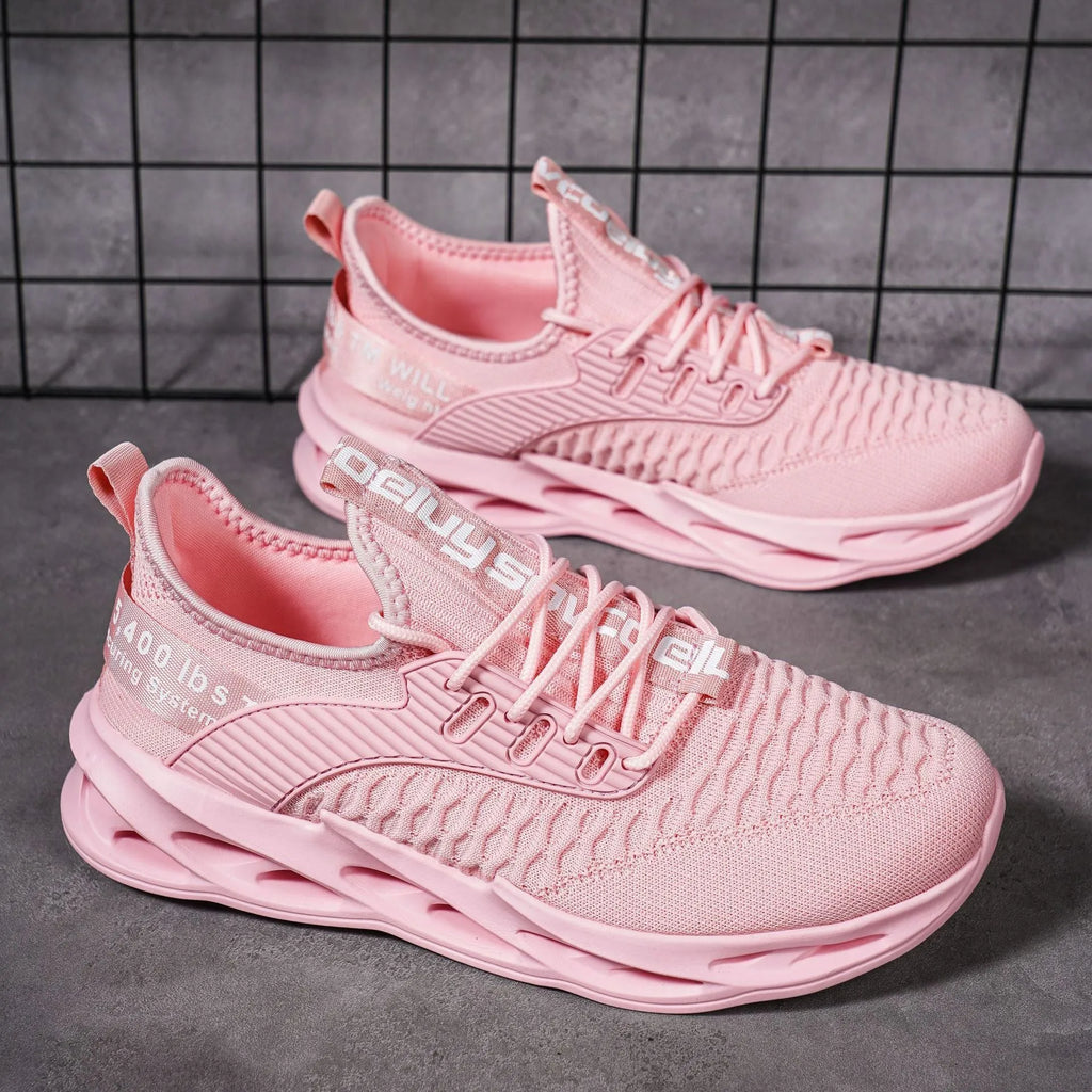 Women's casual FlyKnit shoe in a solid colour, showing mesh upper, round toe, and flat heel.