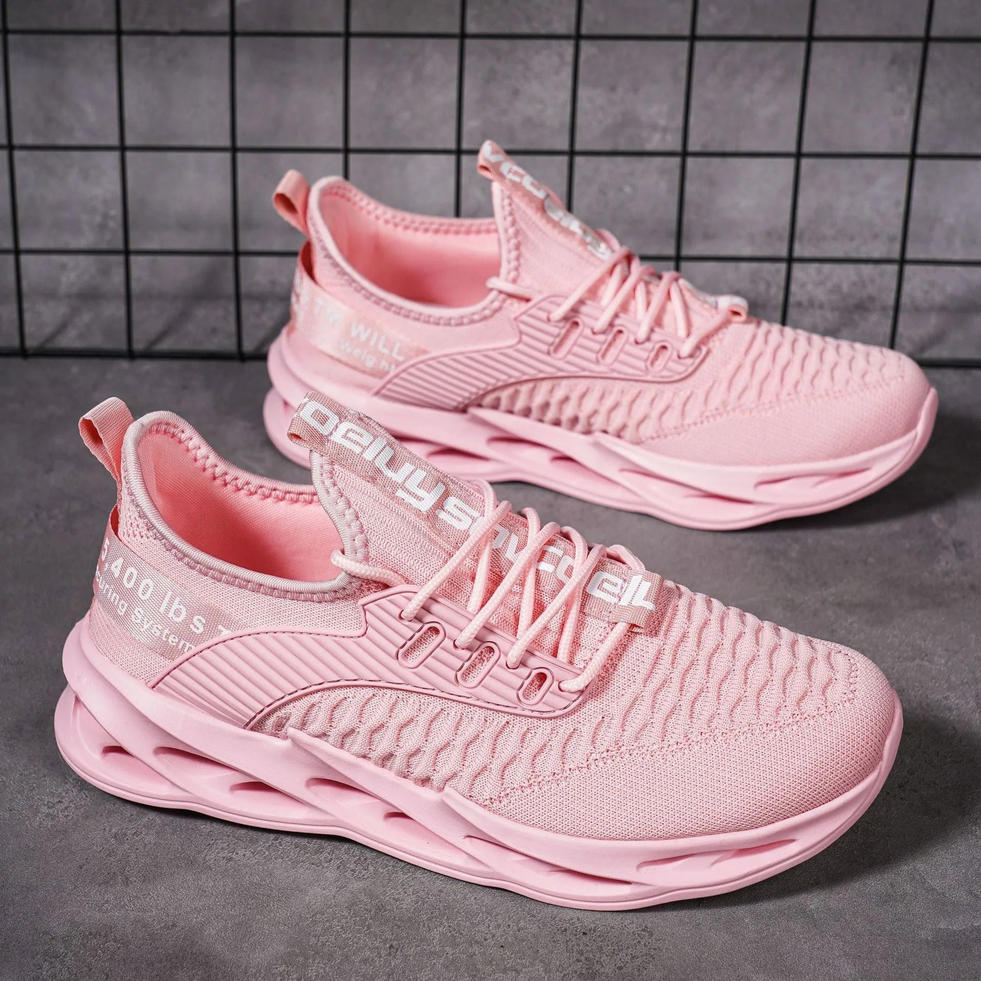 Women's casual FlyKnit shoe in a solid colour, showing mesh upper, round toe, and flat heel.