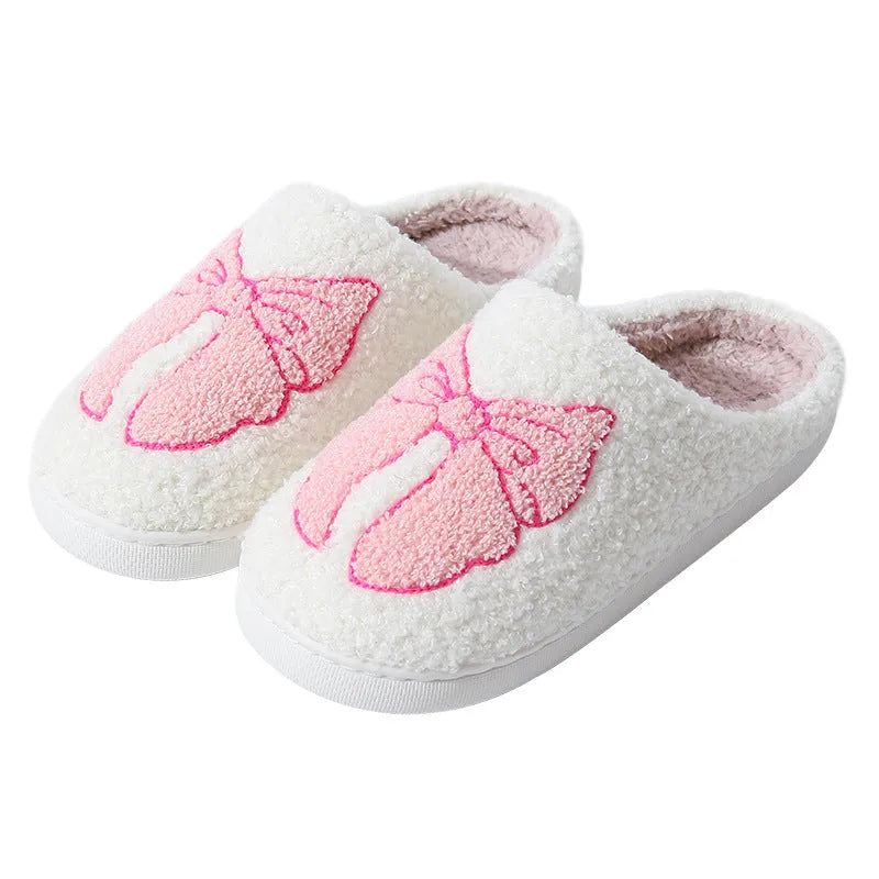 Pink and blue cartoon bow knot oversleeve slippers with suede upper and TPR sole.