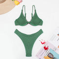 Women's green bikini swimsuit with ruffle trim top and split skirt bottom