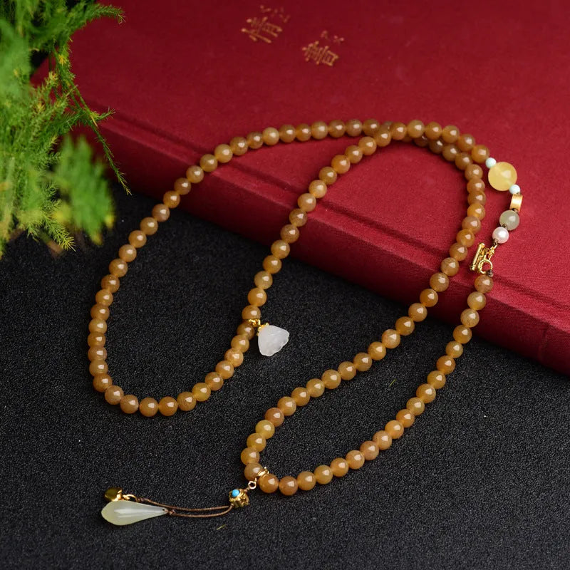 Green pine leaf jade bracelet with 6mm round beads in beeswax clear water colour