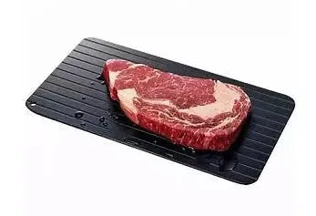 Black aluminium defrosting tray for thawing frozen meat without microwave