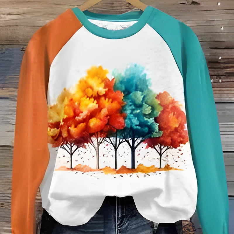 Green women's hoodie with a raised 3D cartoon character print on the front, showing regular long sleeves and a pullover design.