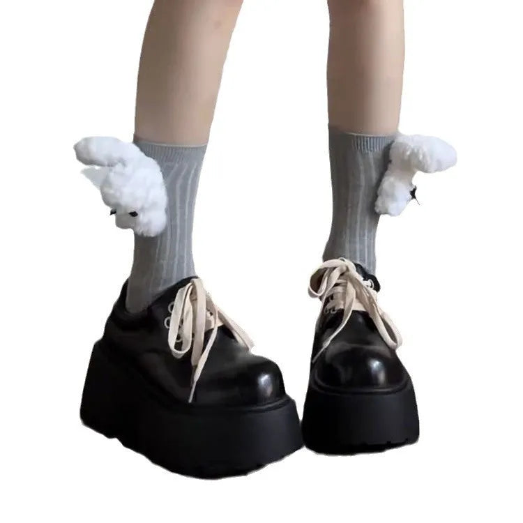 Matte black women's low-top shoes with a chunky muffin heel and buckle fastening.