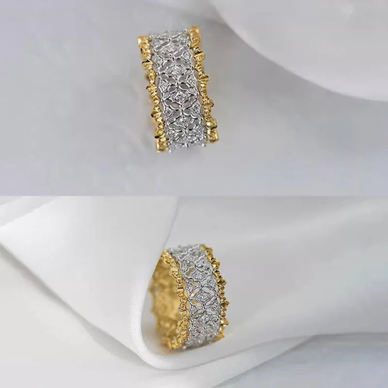 Gold two-tone geometric copper zircon ring on a plain background.
