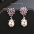 Women's drop shape pearl earrings with zircon accents on 18K gold plated copper setting