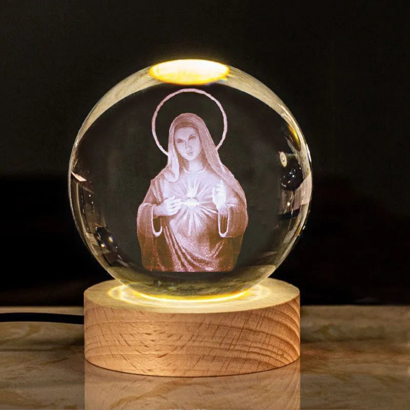 White crystal ball desk ornament on a wooden warm light base, showing purity-themed designs.