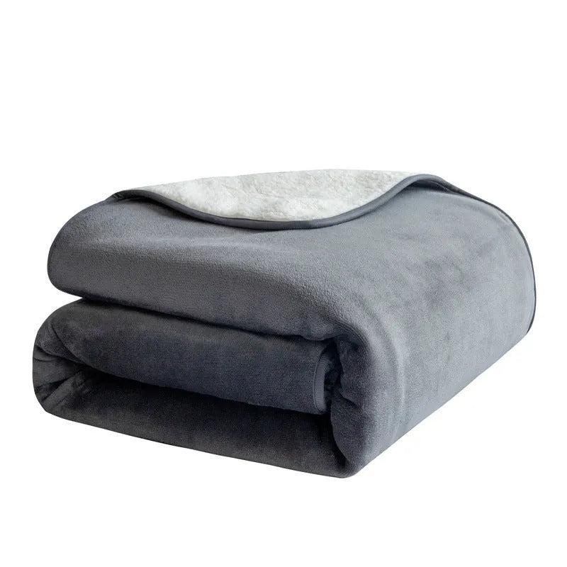 Lambswool waterproof dog blanket in grey, folded to show size and cloth texture.