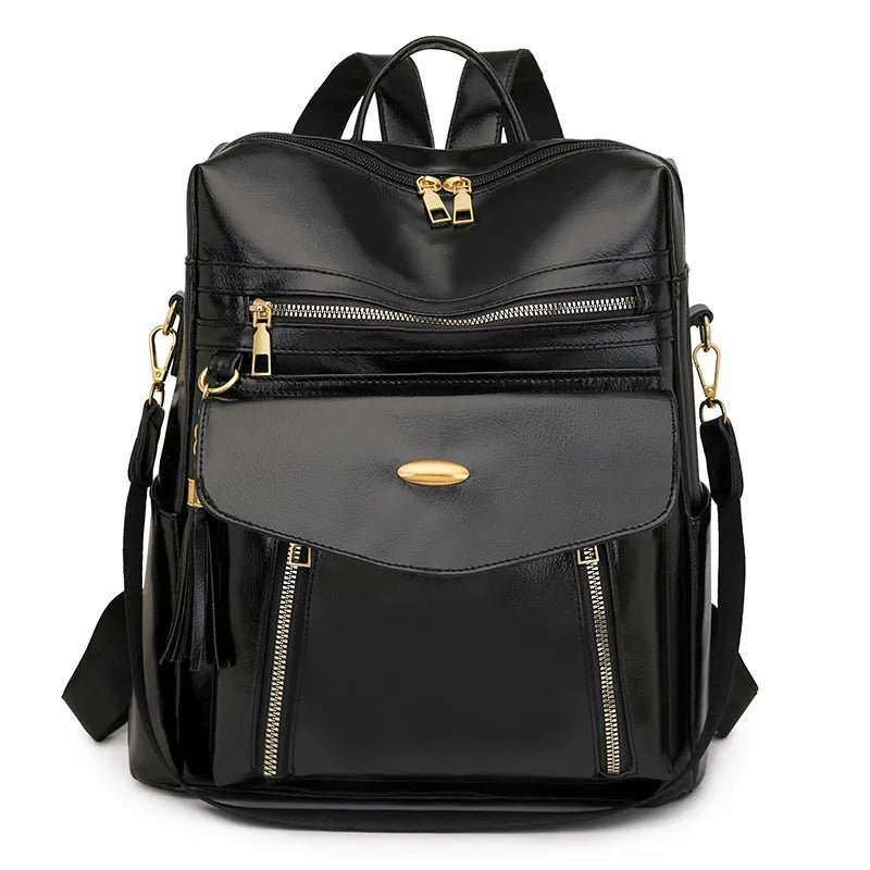 Crossbody casual ladies backpack in PU with soft construction, sewing thread details, black colour, phone pocket