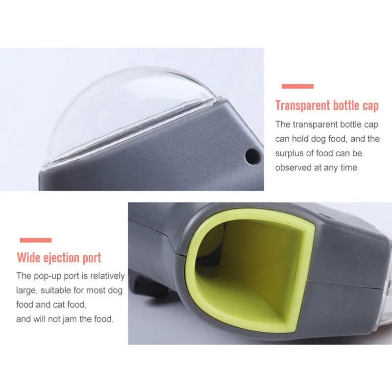 Grey pet snack catapult launcher toy on grass, showing spring trigger and treat slot.