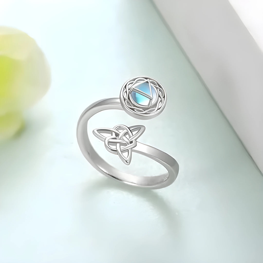 Rotating moonstone ring with adjustable opening, white gold electroplated finish, geometric circle and triangle design