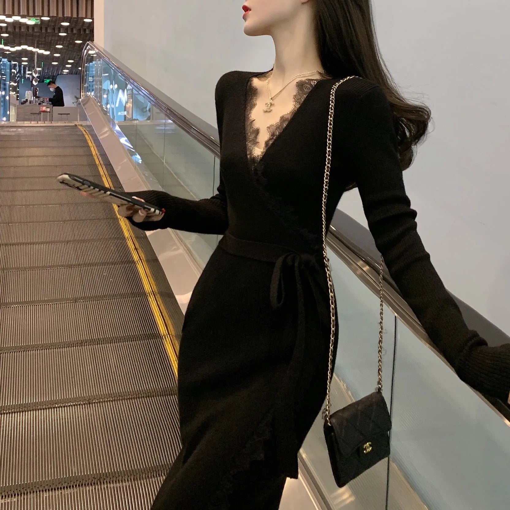 Black women's slim fit woolen skirt with a princess dress cut, made from polyester fabric.