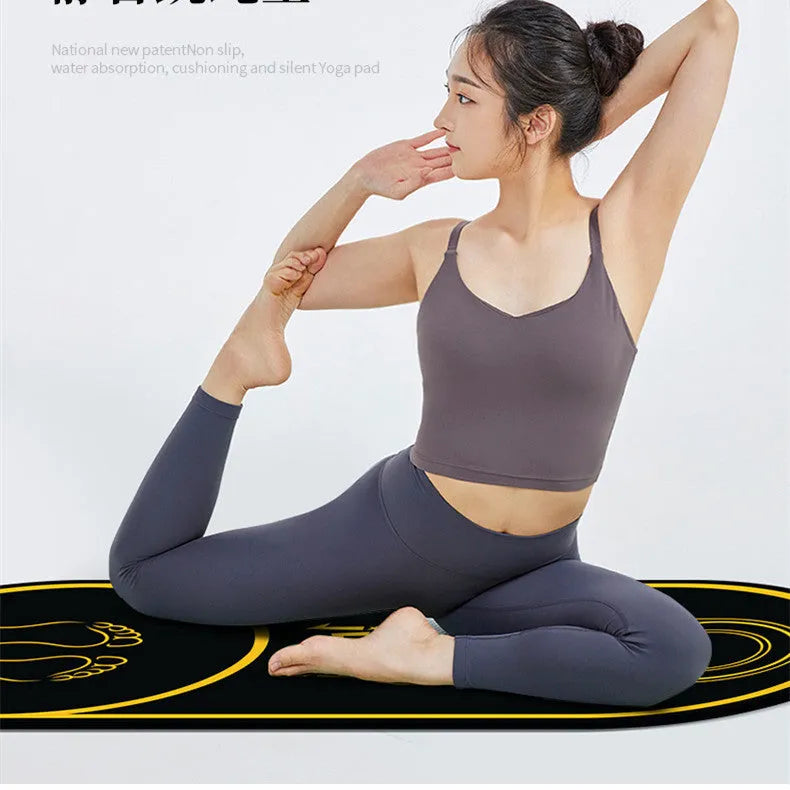 A black faux leather yoga mat showing its textured non-slip surface and 6mm thickness edge.