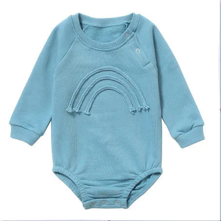 Infant wearing a beige waffle cotton long sleeve romper climbing suit