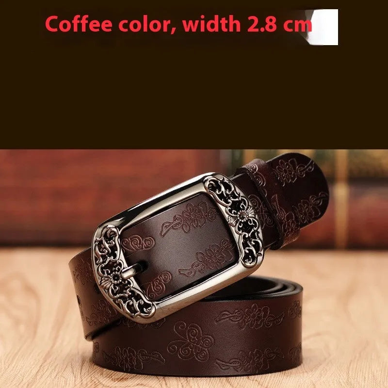 Thin black PU leather women's decorative belt with an alloy buckle on a pair of jeans.