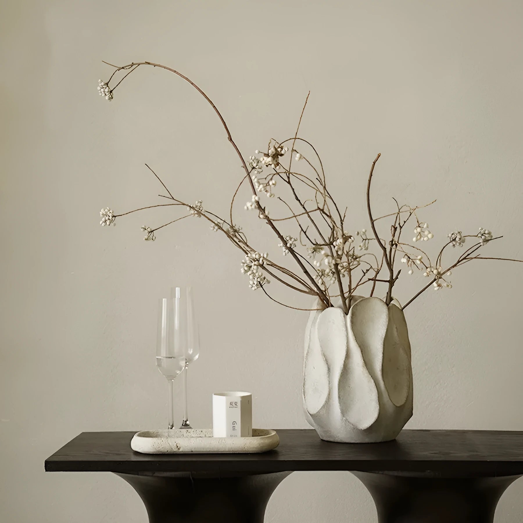 Irregular ceramic vase with resin flower device accents in magnesium clay material
