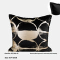 Black and gold abstract pattern flannel pillow cushion on a sofa, shown with removable cover.
