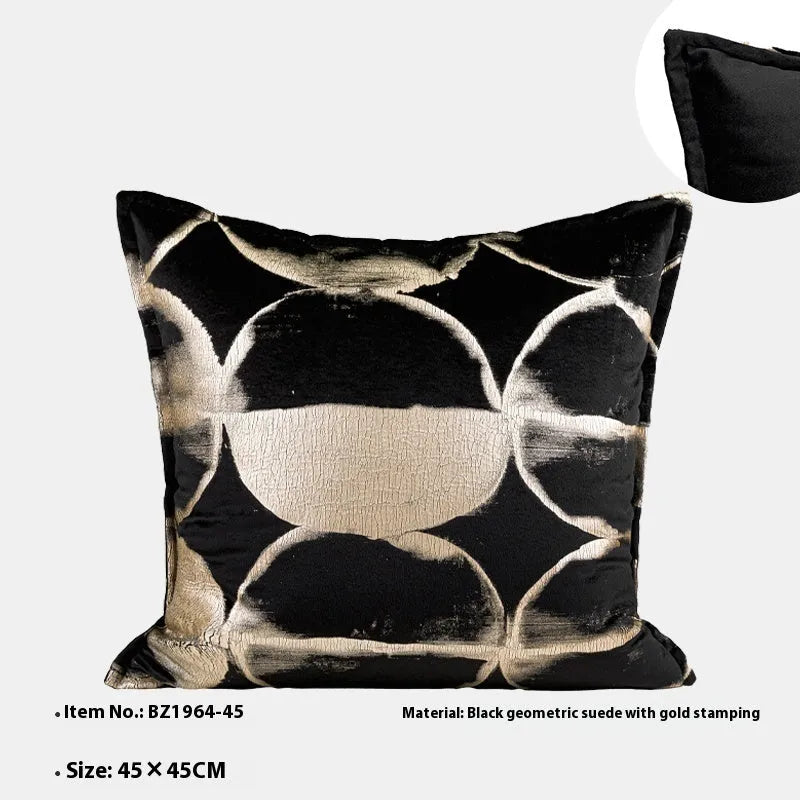 Black and gold abstract pattern flannel pillow cushion on a sofa, shown with removable cover.
