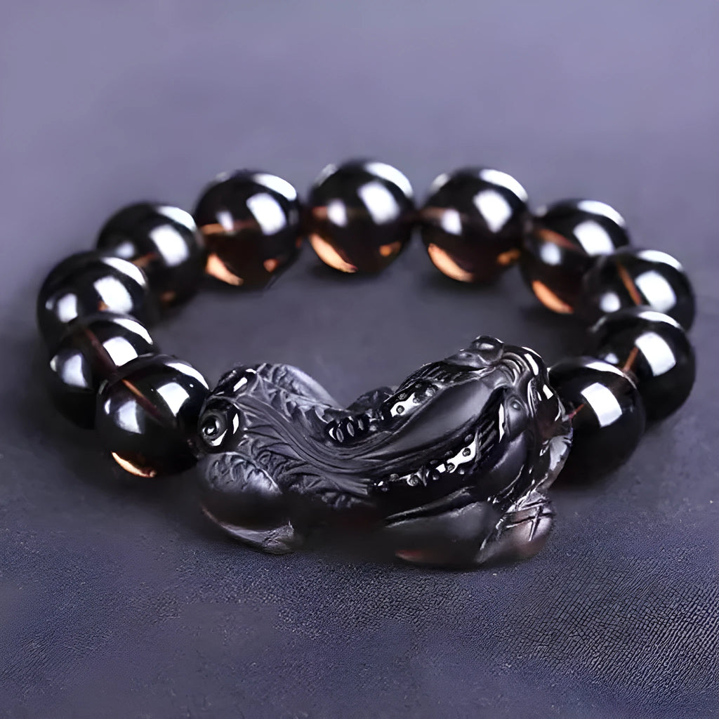 Kaiguang natural ice species black anthracite raspberry stone beaded bracelet on a plain background