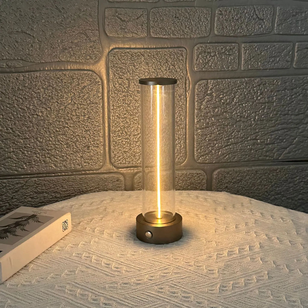Slender glass LED light strip with magnetic base for USB charging night light.