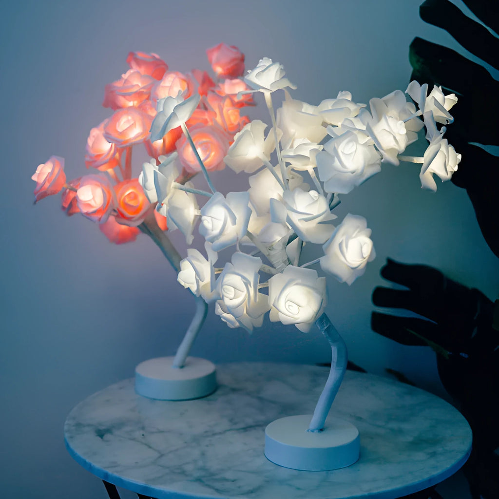 White and red rose flower shaped USB battery LED table lamp with warm white light on a table