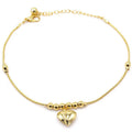 Gold colour gothic heart pendant anklet on a woman's ankle with chunky ball beads and copper chain 27cm