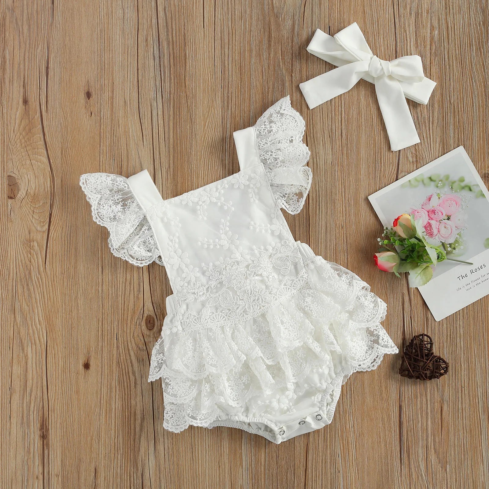 White 100% polyester baby bodysuit for Christmas, shown in real product photography.