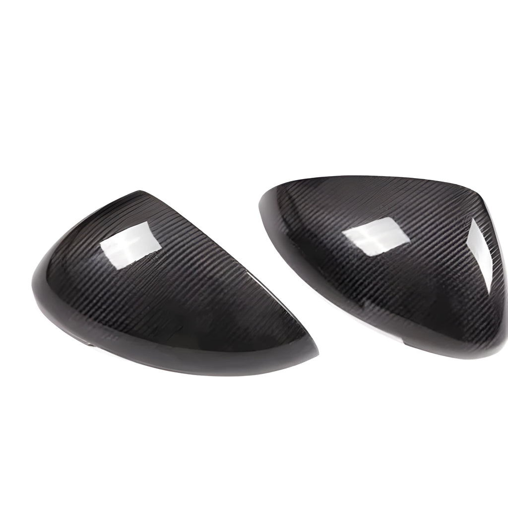 Pair of real carbon fibre rearview mirror covers for Porsche Macan, showing black woven texture.