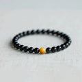 Korean-style geometric obsidian bracelet with natural eye pattern stones