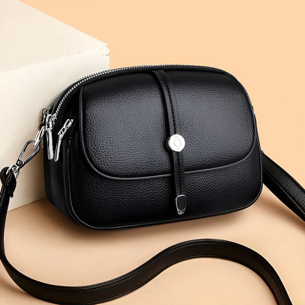 City Simple women's oval crossbody shoulder bag in soft PU leather with sewing thread details
