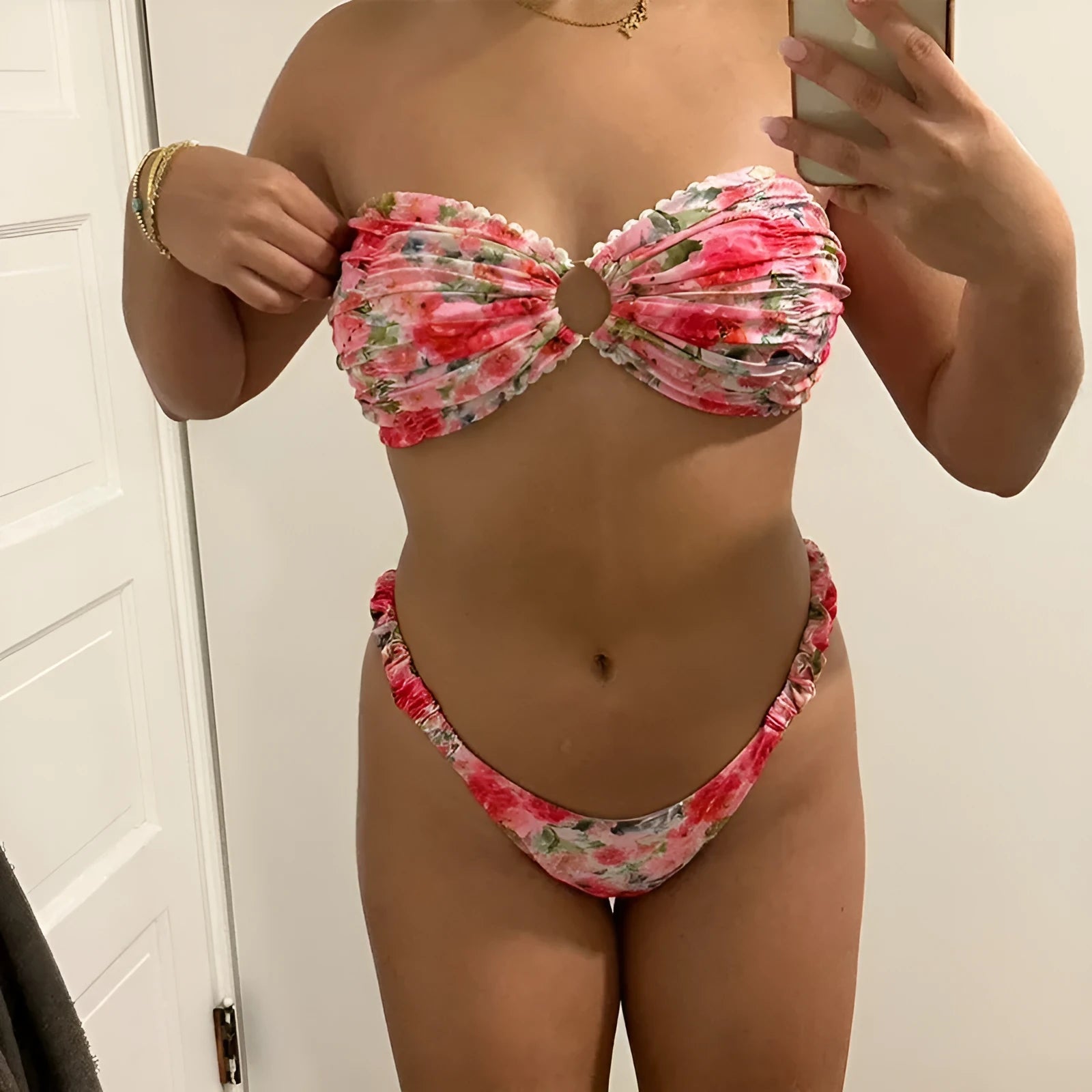 Women's polyester bikini set with floral print tube top and matching briefs for swimming.