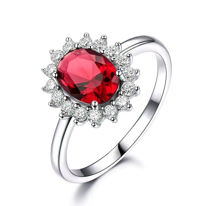 Electroplated copper ring with floral shape and zirconium inlay, shown in green, blue, and red colour options.
