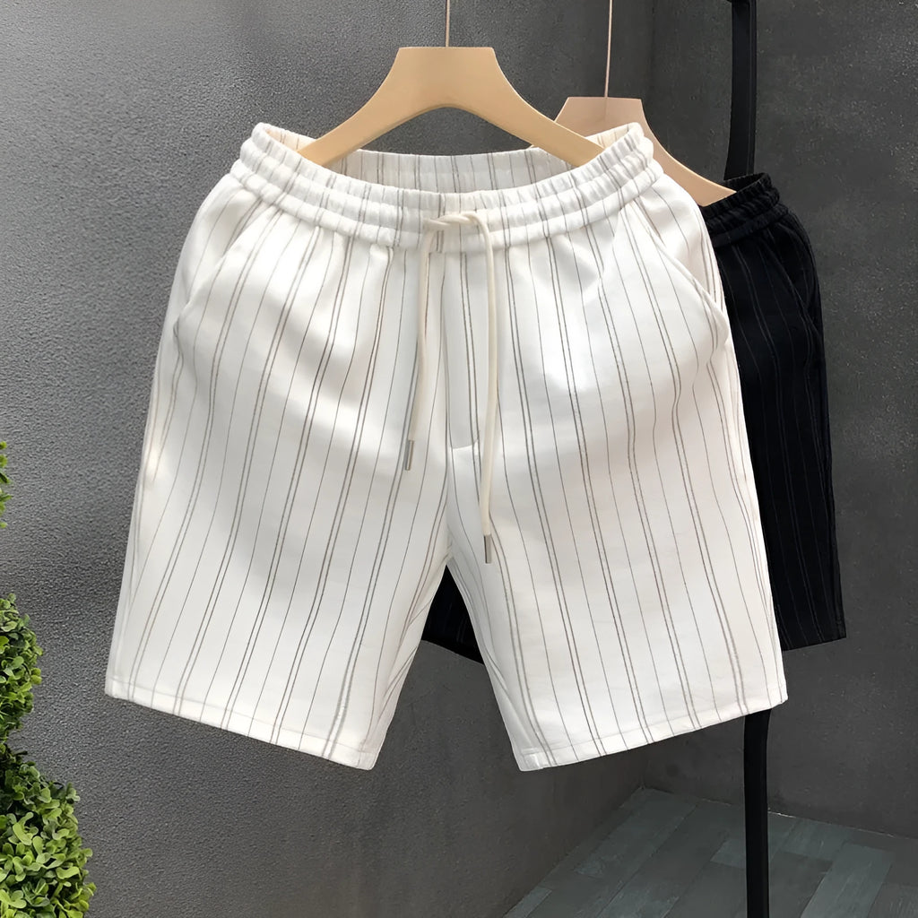 Men's black and white striped casual shorts with fleece lining and elastic waistband