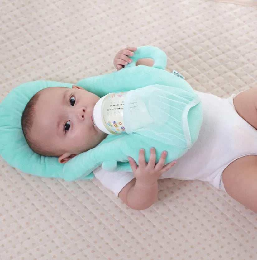 Plush confinement baby feeding pillow in soft colours, measuring 30cm by 42cm.