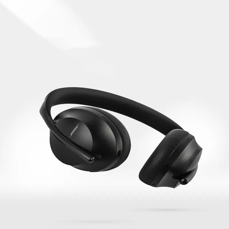 Wireless noise reduction bluetooth headset in Black with cushioned ear pads and adjustable headband