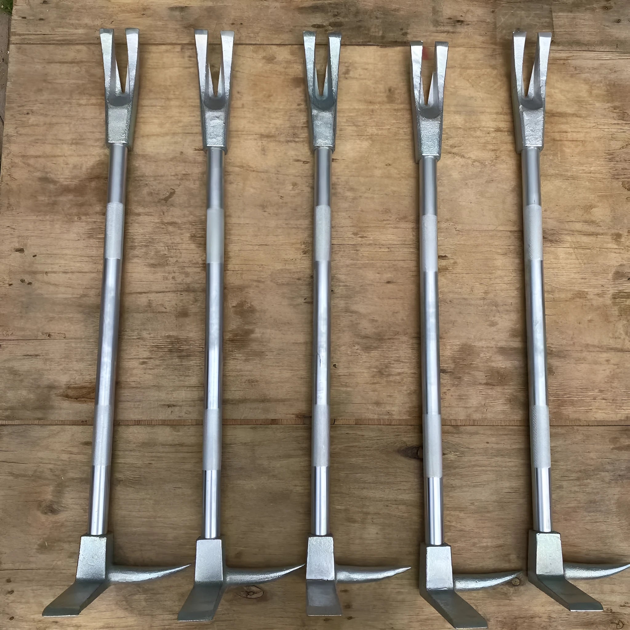 Silver carbon steel wrecking bar 24 inches 61cm multifunctional fire breaking tool on plain background