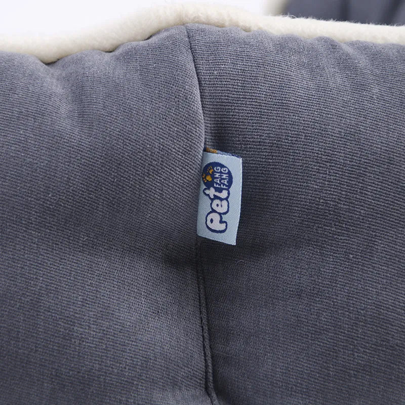 Blue Liscel fabric sponge-filled dog cushion on a sofa for pet comfort