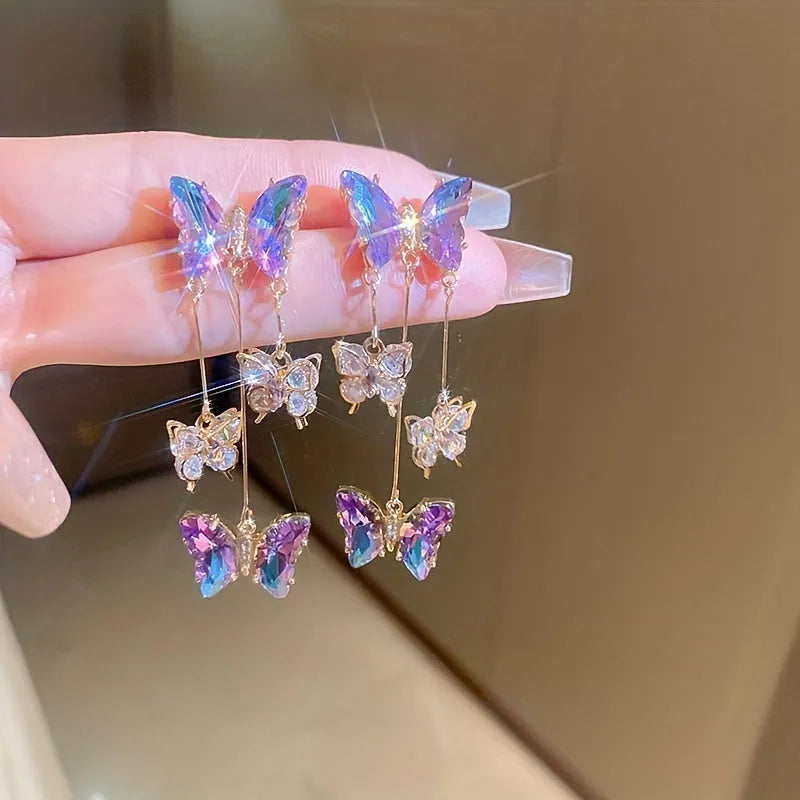 Silver Needle blue purple butterfly tassel earrings with crystal flowers on alloy chains, showing 7cm drop length.