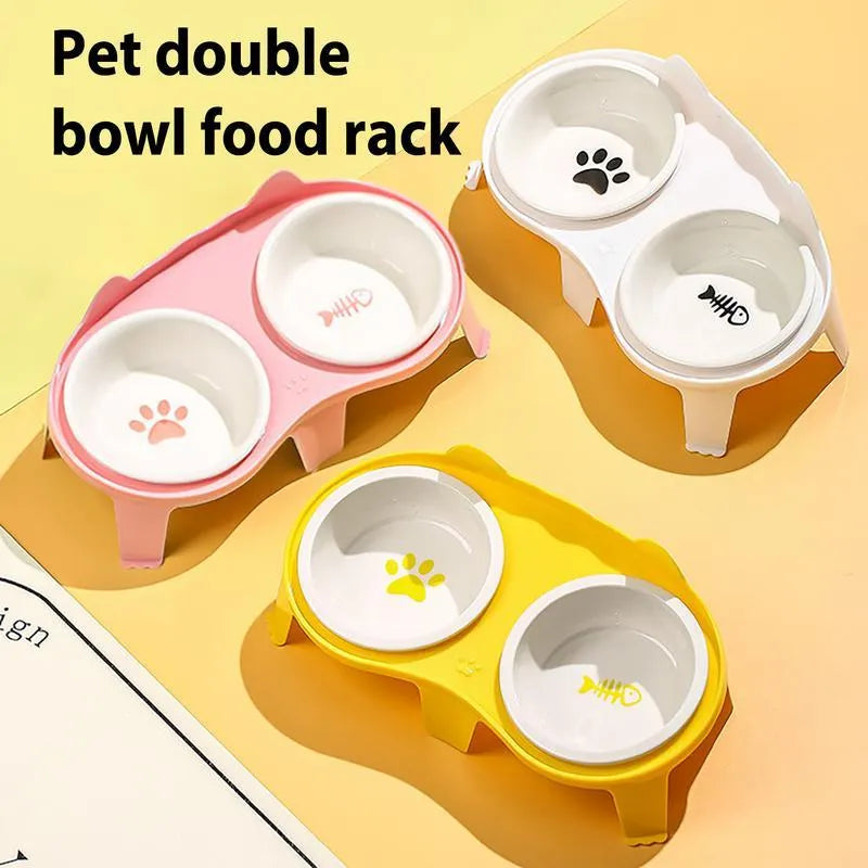 Blue ceramic cat food and water bowl set on a white stand with a hook, showing tilted feeding angle.