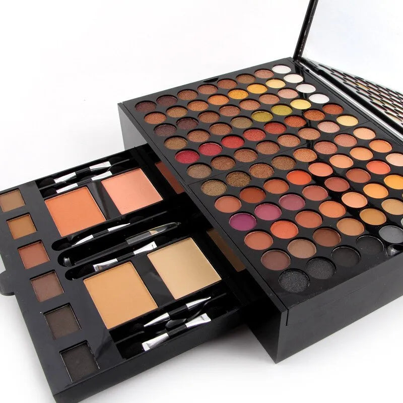 Piano-shaped makeup palette showing 180 colour eyeshadows, blushes, and powders in organised layout