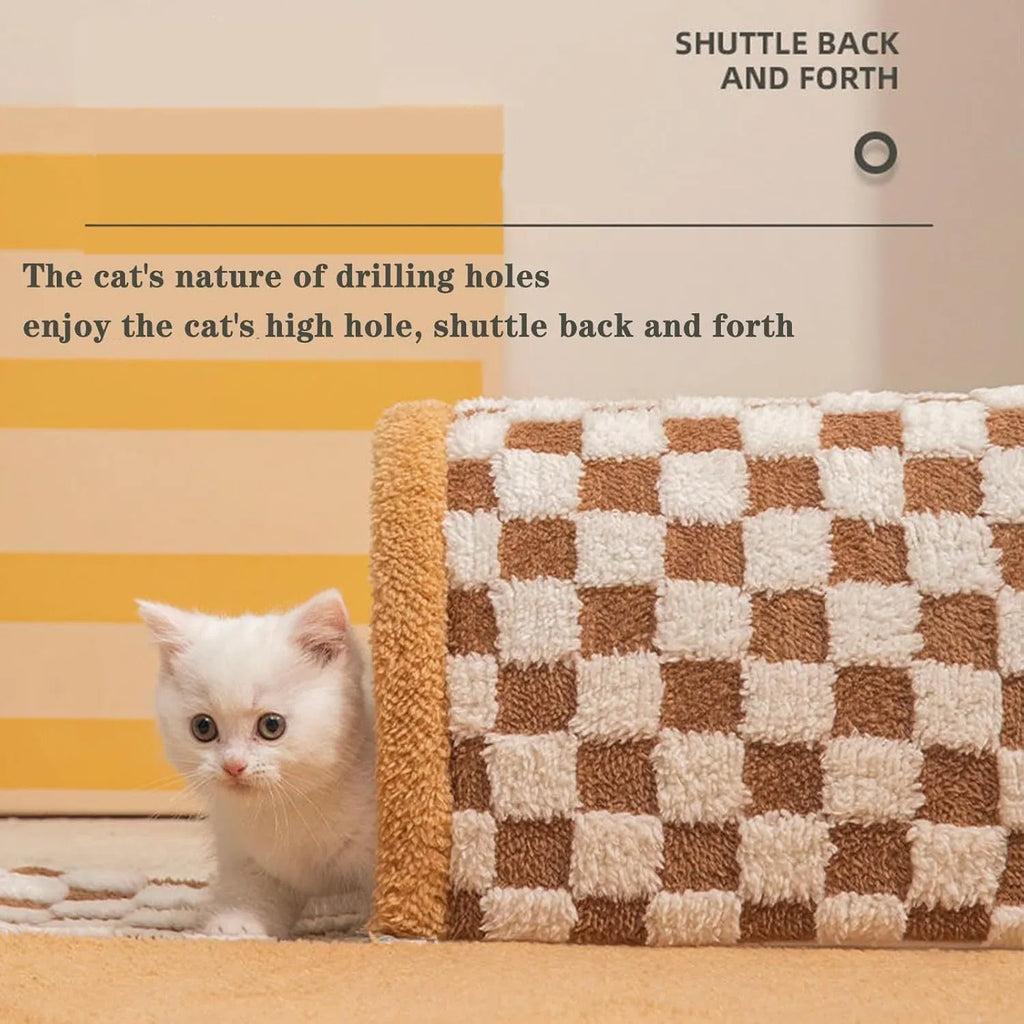 Brown plush plaid cat tunnel bed with a central mat, shown on a wooden floor.