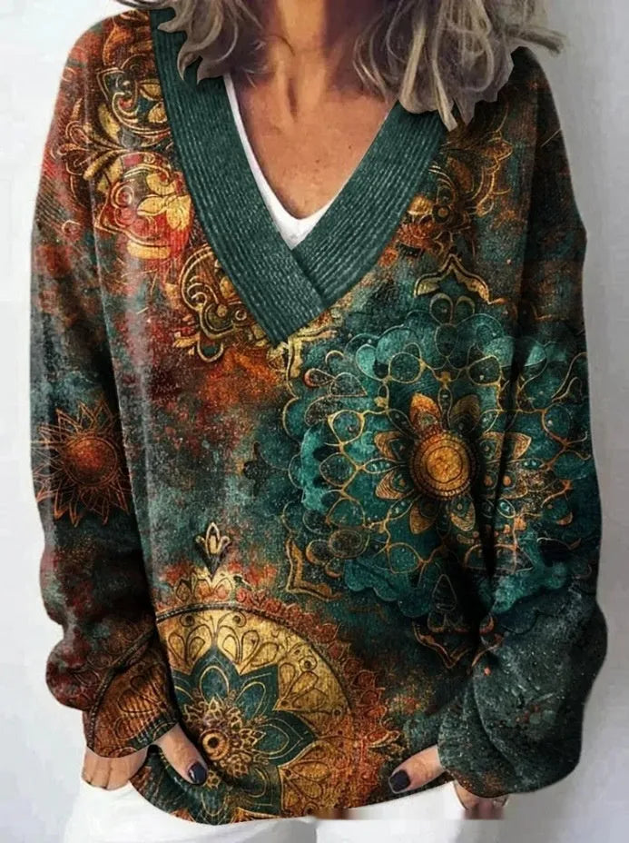 Women's V-neck long sleeve sweatshirt with a textured 3D floral print pattern in a retro style.