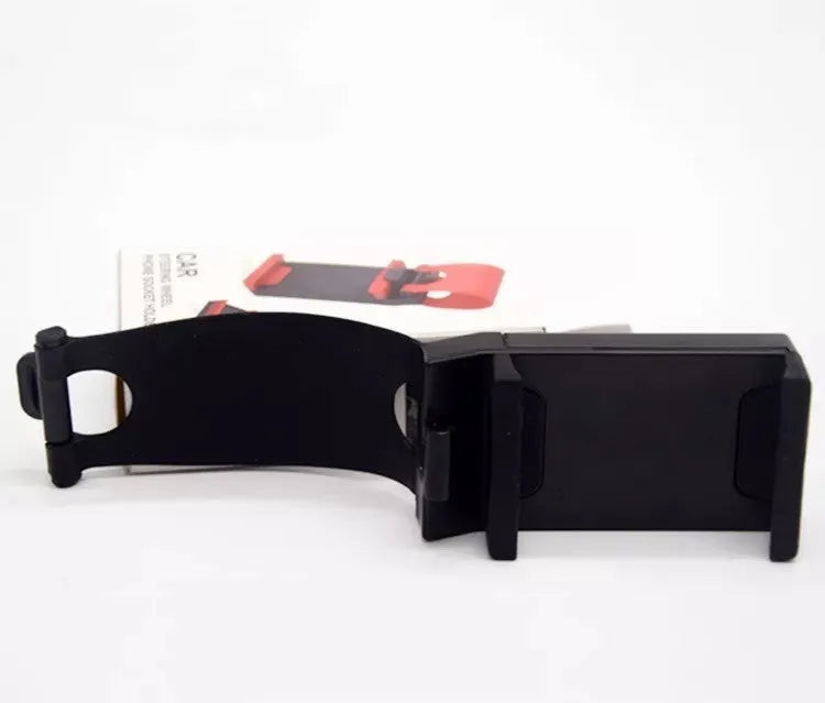 A black car steering wheel mobile phone holder made of ABS plastic.
