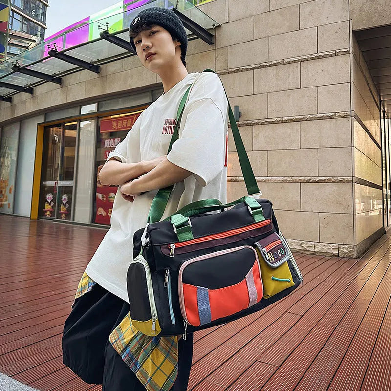 Large black sports shoulder messenger bag with Oxford cloth construction and 36-55L capacity