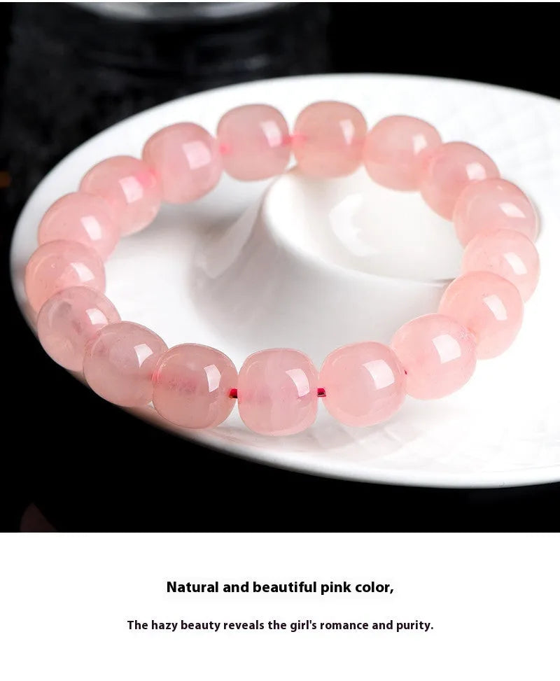 Pink crystal barrel bead bracelet with 8x10mm geometry-shaped stones on wrist