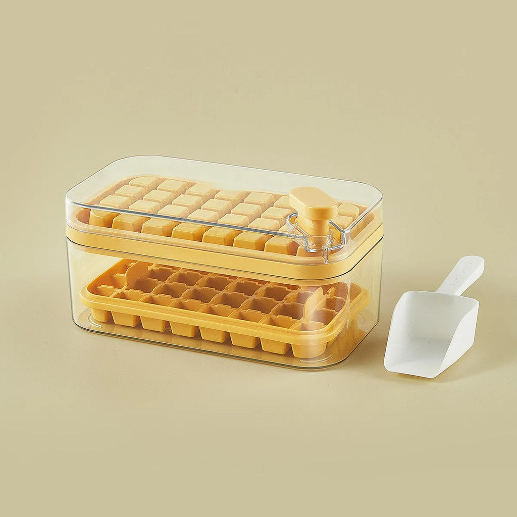 Green plastic ice cube tray with one-button release mechanism and a clear storage lid.