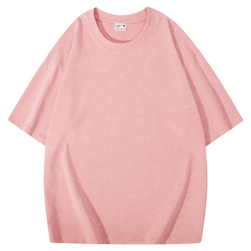 Loose-fit pure cotton batik distressed t-shirt in a solid colour, showing round neck and washed finish.
